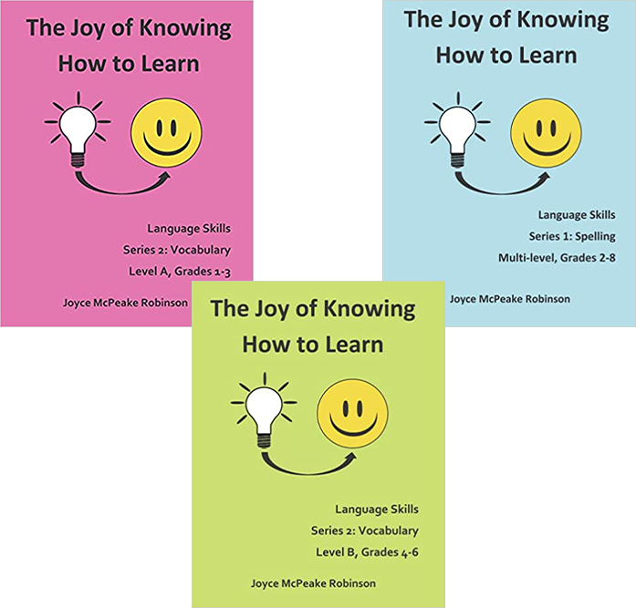 Three different books with a smiley face on them.